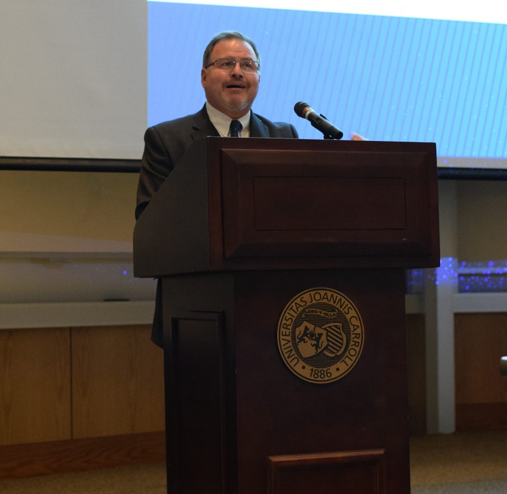 Dr. Alan Miciak, dean of the Boler School of Business, speaks to faculty, staff and students about the generosity of John and Mary Jo Boler. He recalled some remarks that John Boler gave during the 1994 commencement address: “Let it be read that as Carroll graduates, we understood our individual lives would not be judged on how we reach our goals, but rather on how we helped others reach theirs.”