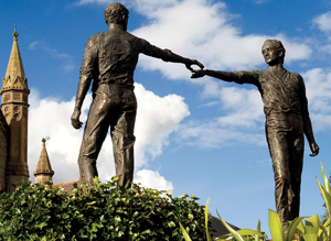 The Hands Across the Divide monument in Derry, Northern lreland, near the Craigavon Bridge symbolizes the spirit of reconciliation and hope for the future. It was unveiled in 1992, 20 years after Bloody Sunday. The bronze sculpture was designed by Maurice Harron, a teacher in Derry.