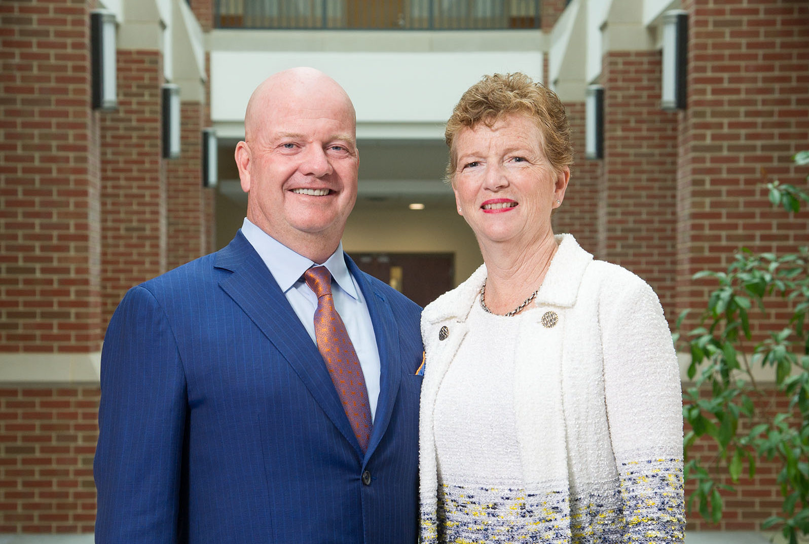 Bill and Sue Donnelly smile int he Dolan Science Center Atrium