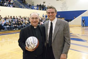 In February 2009 with Coach Mike Moran. JCU Athletics saluted members of the Society of Jesus and presented an autographed basketball to Fr. Niehoff as part of Ignatian Heritage Week.